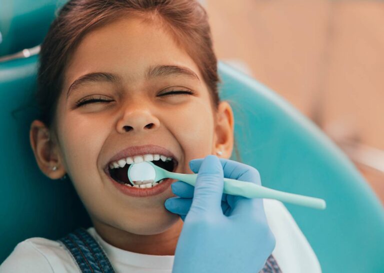 concept image of kid happy at the dentist receiving dental treatments for kids